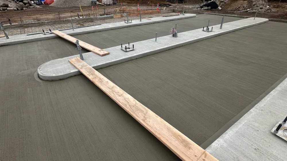 Screeding the pour. Executive Building Systems project.