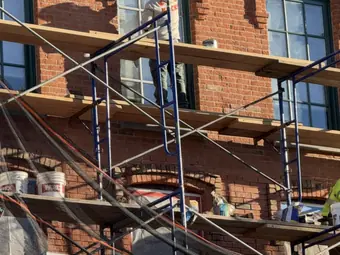 Façade repair from the swing stage, Peekskill, NY. Executive Building Systems project.