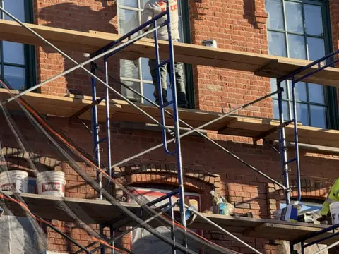 Façade repair from the swing stage, Peekskill, NY. Executive Building Systems project.