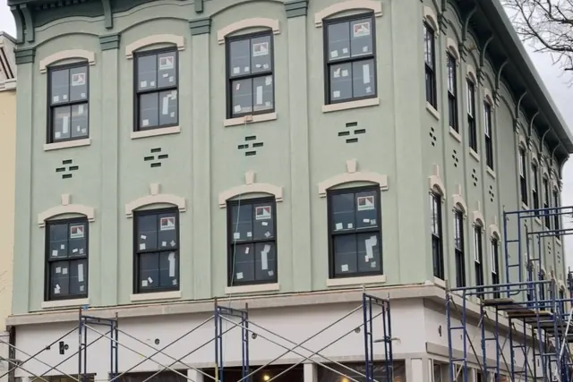 Corner elevation under scaffold. Executive Building Systems project.