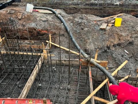 Placing footings. Executive Building Systems project.