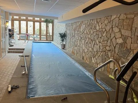 Indoor pool and stone wall. Executive Building Systems project.