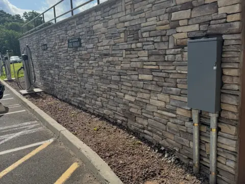 Stone wall along the drive. Executive Building Systems project.
