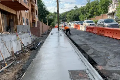 Fresh sidewalk pour. Executive Building Systems project.