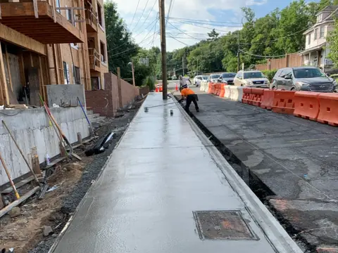 Fresh sidewalk pour. Executive Building Systems project.