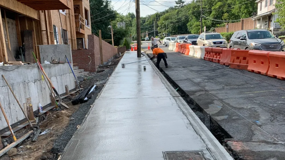 Fresh sidewalk pour. Executive Building Systems project.