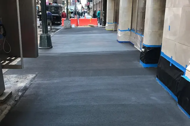 Sidewalk work under a shed, Midtown East, NYC. Executive Building Systems project.