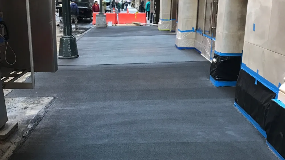 Sidewalk work under a shed, Midtown East, NYC. Executive Building Systems project.