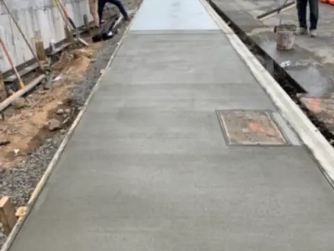 Sidewalk crew at work. Executive Building Systems project.