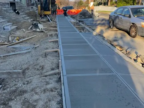 Jointed sidewalk bays. Executive Building Systems project.