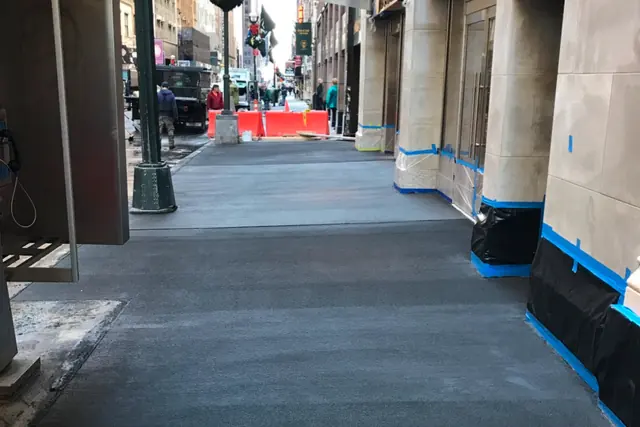 Sidewalk under bridging. Executive Building Systems project.
