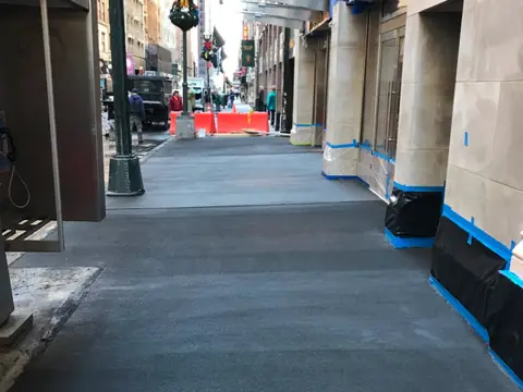Sidewalk under bridging. Executive Building Systems project.