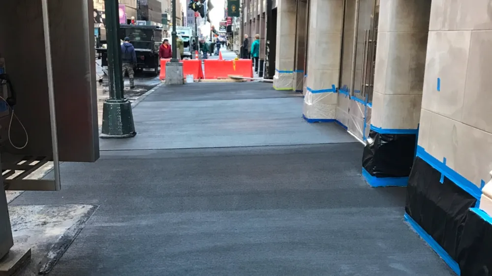 Sidewalk under bridging. Executive Building Systems project.